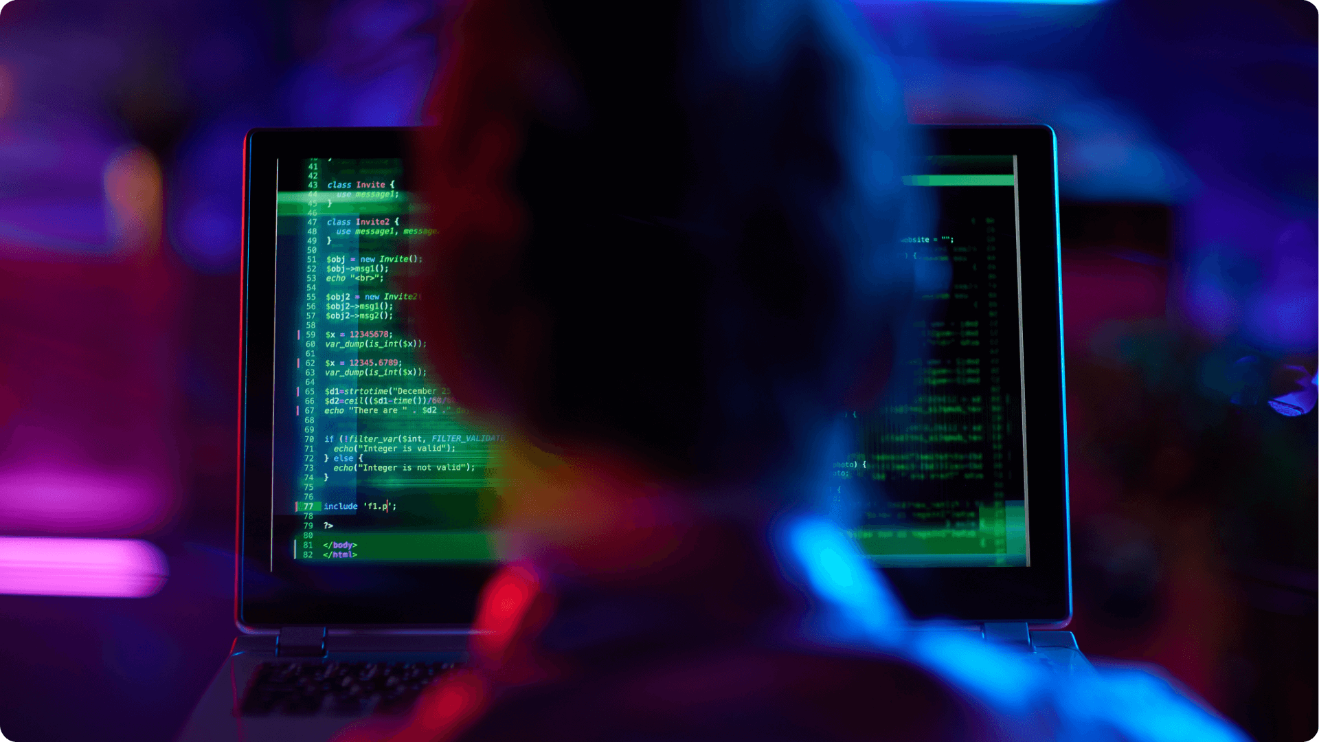 an IT worker using a computer to help work cybersecurity (1)