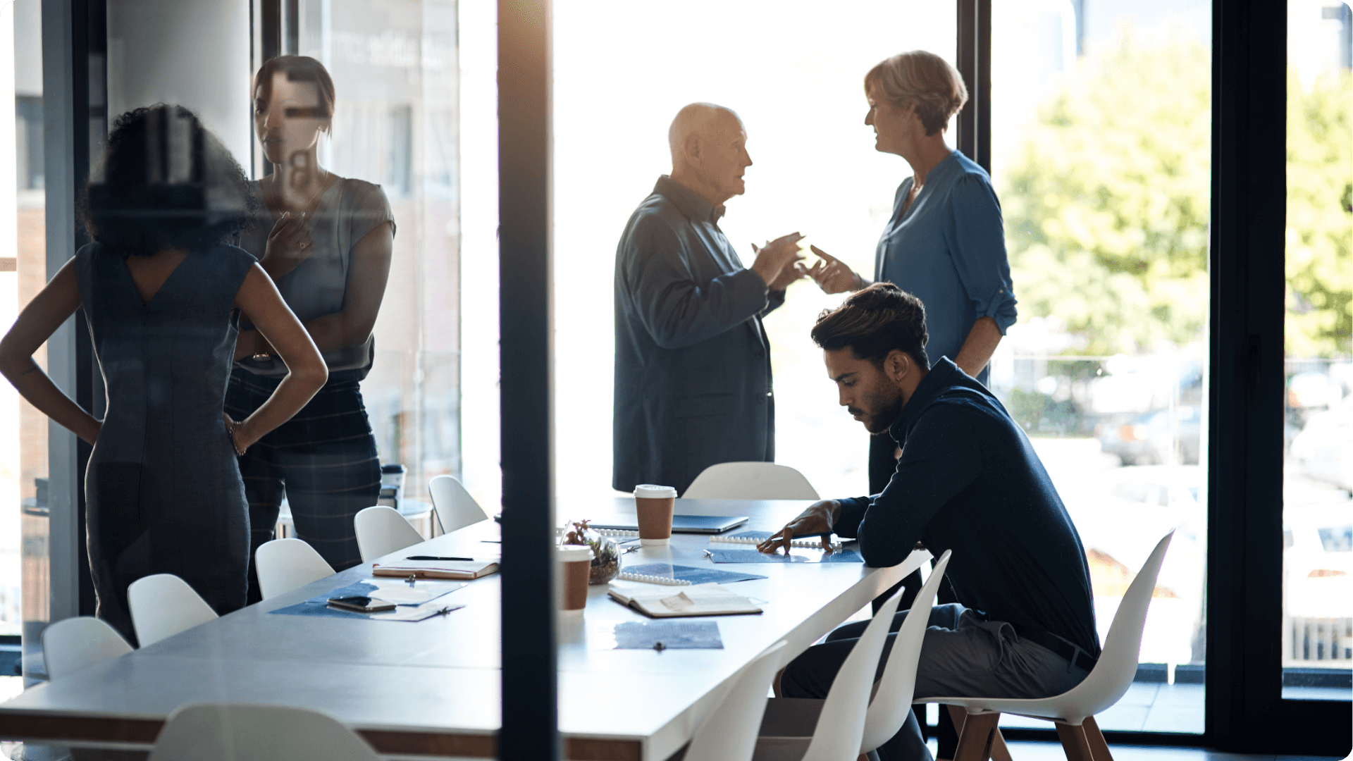 A group of IT professionals having a meeting inside of an office, discussing special IT projects (1)