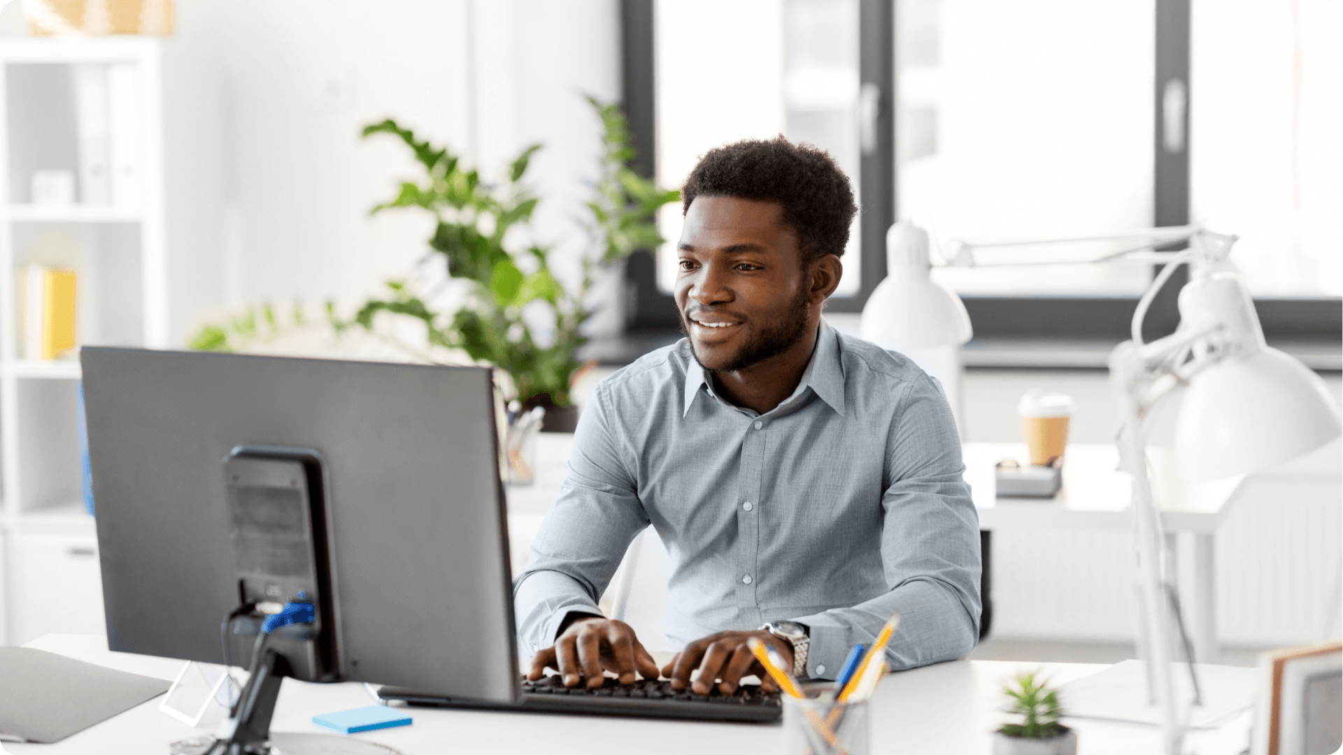 An IT engineer monitoring data on a computer. (1)